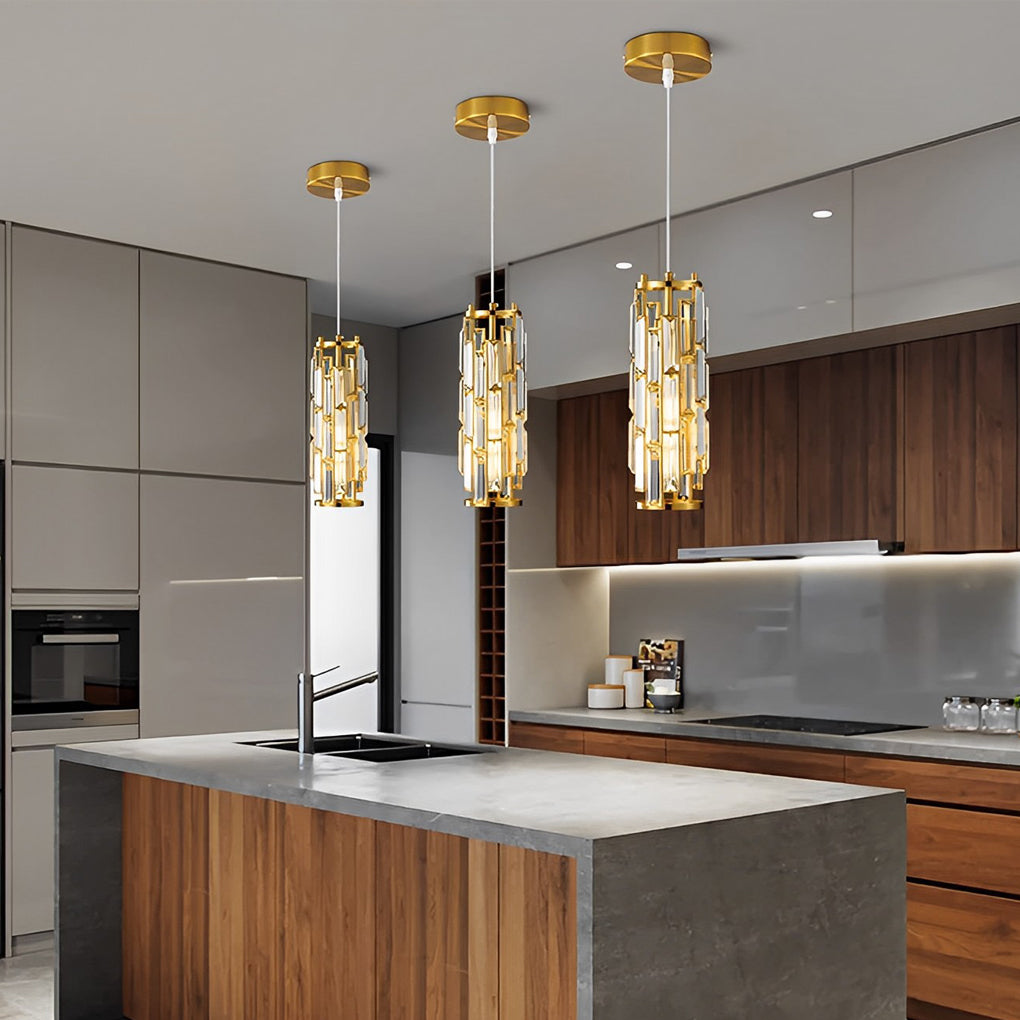 Gold mini crystal pendant lights installed above a contemporary kitchen island.