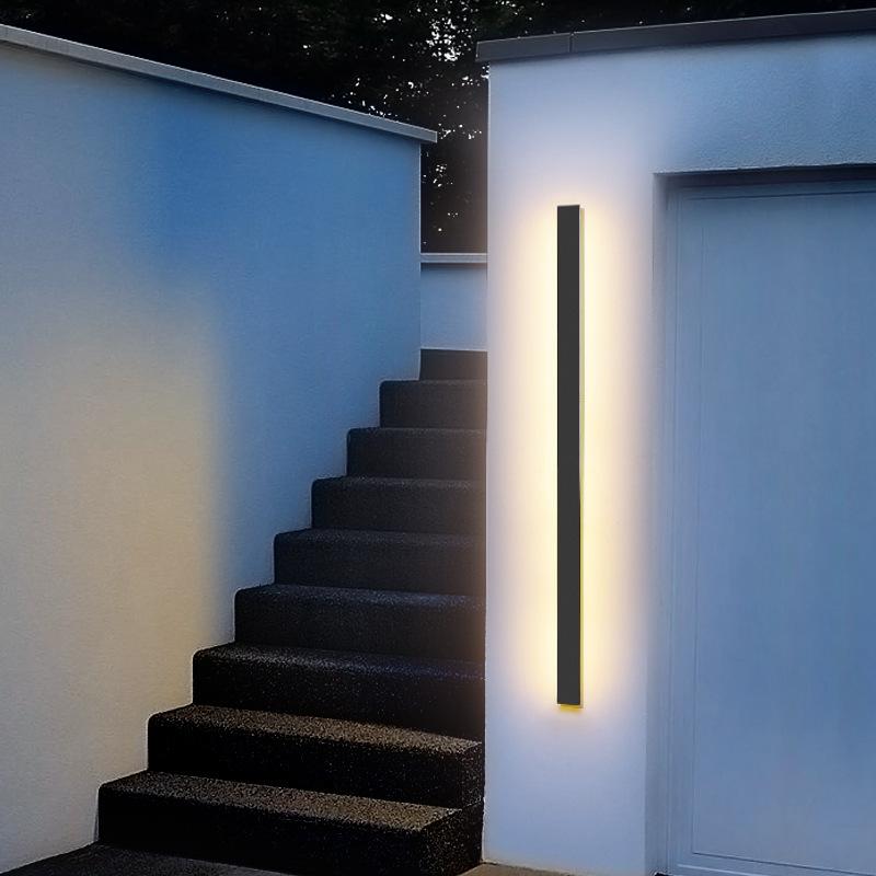 Outdoor strip wall light enhancing a contemporary porch with vertical light.