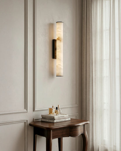 Circular LED wall sconce detail in a contemporary room