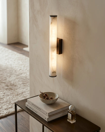 Modern circular wall light illuminating a neutral interior