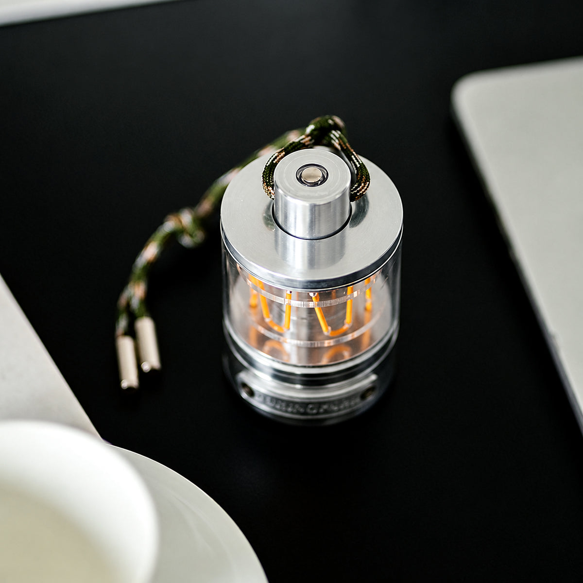 Top view of the Heartbeat Glow portable lantern on a dark tabletop.