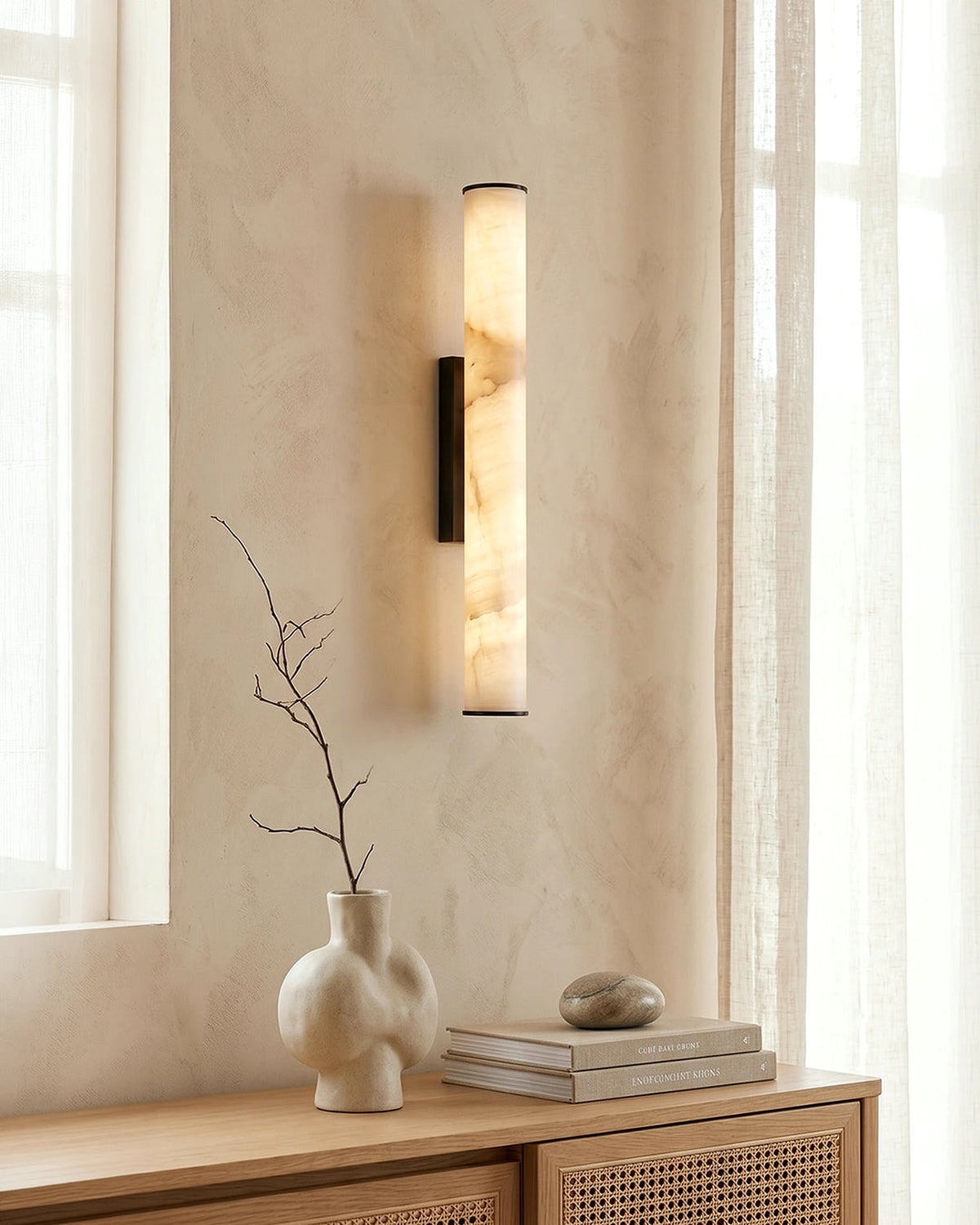 Gold and black finish options for the circular wall sconce