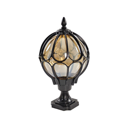 Classical black outdoor globe pillar light with a cage design isolated on white background ok.
