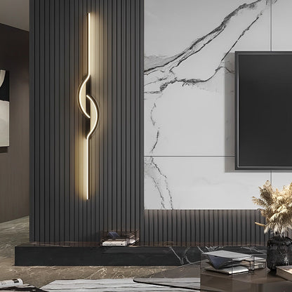 Artistic LED modern linear wall sconce installed on a dark paneled feature wall.