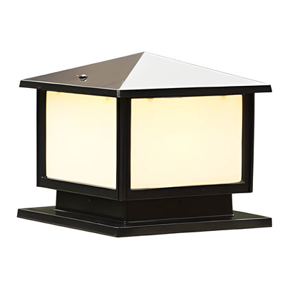 Modern outdoor pillar light with a square shape and frosted panels, offering soft lighting on a stone pillar.